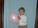 Benjamin holding a balloon